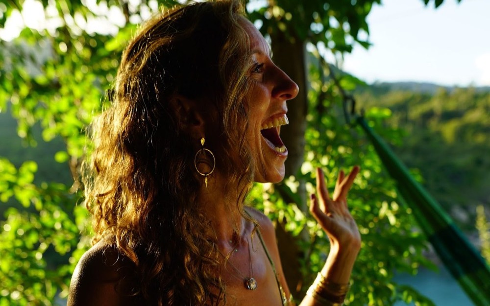 Francie La Flow singing in golden light